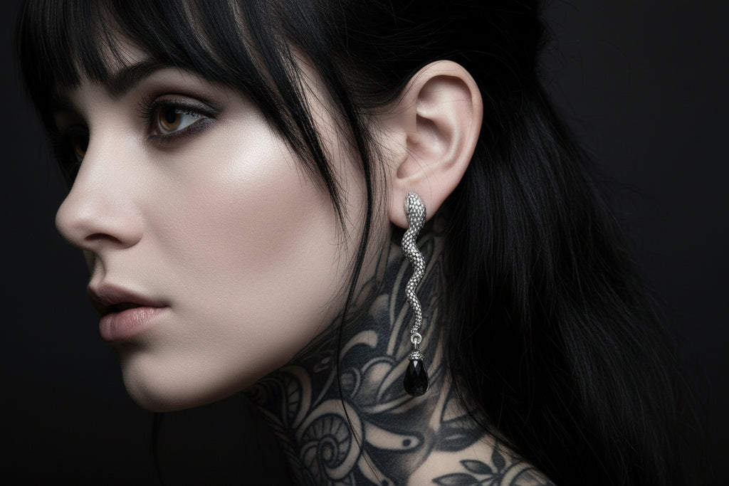 Silver earrings with black beads and measurements on a white background