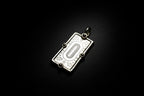 Gold pendant with decorative design on ablakc n white background