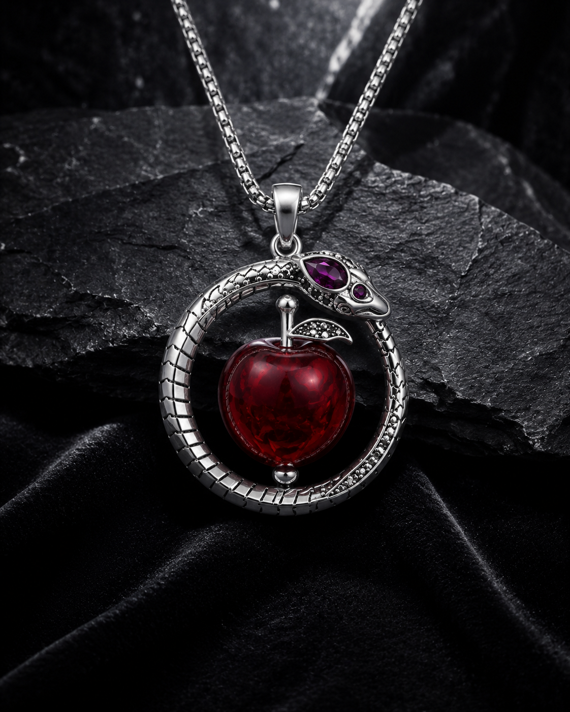 EDEN II silver ouroboros and red apple pendant on black stone